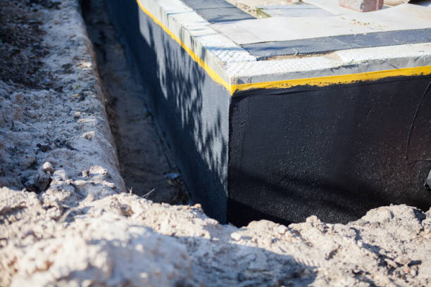 Professional Basement Waterproofing technician working in Lebanon, OR